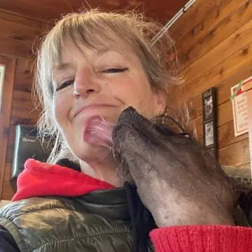 Renee Coker, boarding kennel owner, with one of her boarding dogs